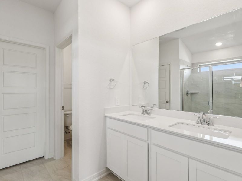 Primary suite bathroom in the Callaghan floorplan at a Meritage Homes community. Primary suite bathroom in the Callaghan floorplan at a Meritage Homes community.