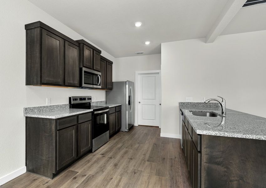 The kitchen has a wonderful breakfast bar.