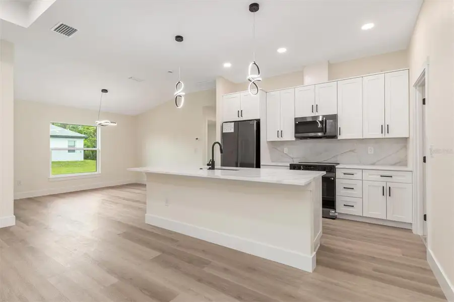 Furnished interior view inside a new home in , Port Charlotte (Image 6).