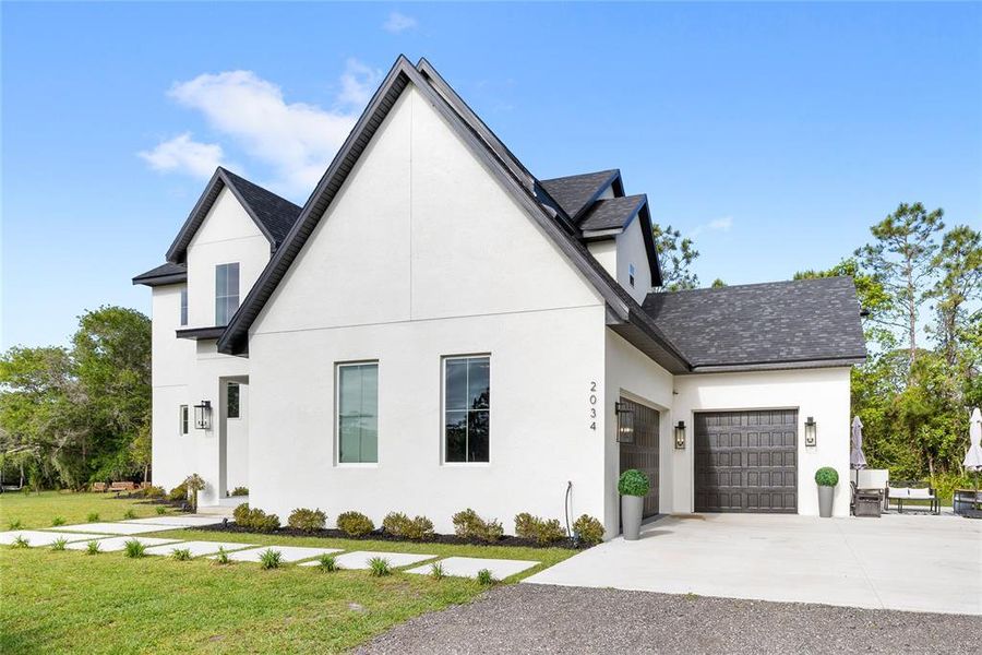 Front exterior of a new home in , St. Cloud, FL, highlighting curb appeal (Image 27).