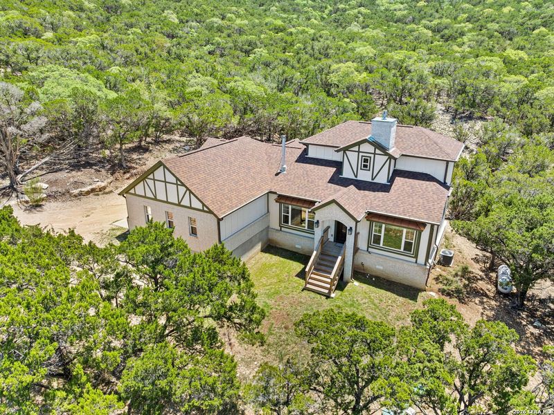 Front exterior of a new home in , Bandera, TX, highlighting curb appeal (Image 23).