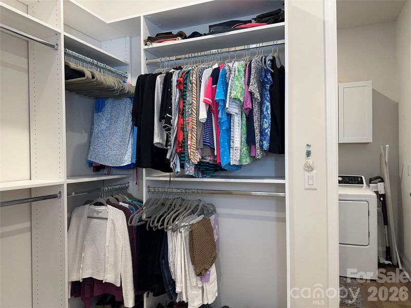 Primary Closet w/ Custom Shelving & Laundry Access Door