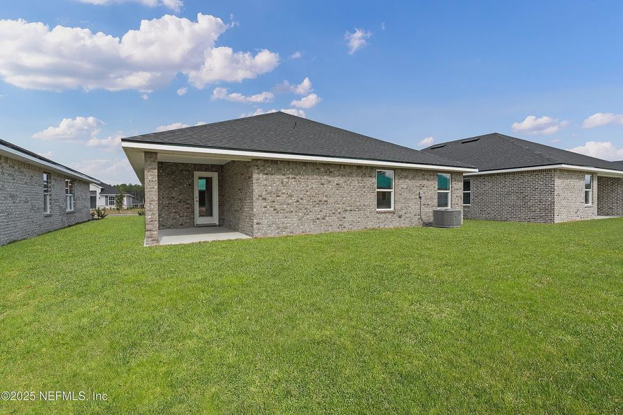 Front exterior of a new home in Shadow Crest at Rolling Hills, Green Cove Springs, FL, highlighting curb appeal (Image 16). Front exterior of a new home in Shadow Crest at Rolling Hills, Green Cove Springs, FL, highlighting curb appeal (Image 16).