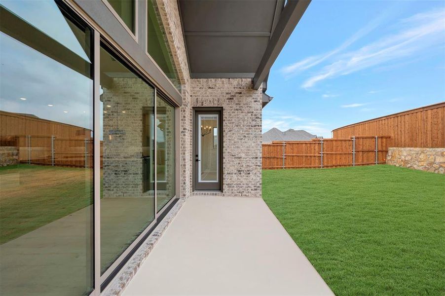 Exterior details and patio area of a home in Terraces – Estates, Rockwall (Image 3).