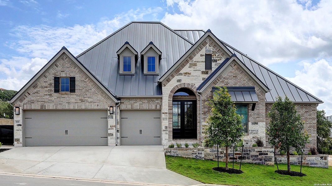 Front exterior of a new home in The Dominion, San Antonio, TX, highlighting curb appeal (Image 2). Front exterior of a new home in The Dominion, San Antonio, TX, highlighting curb appeal (Image 2).
