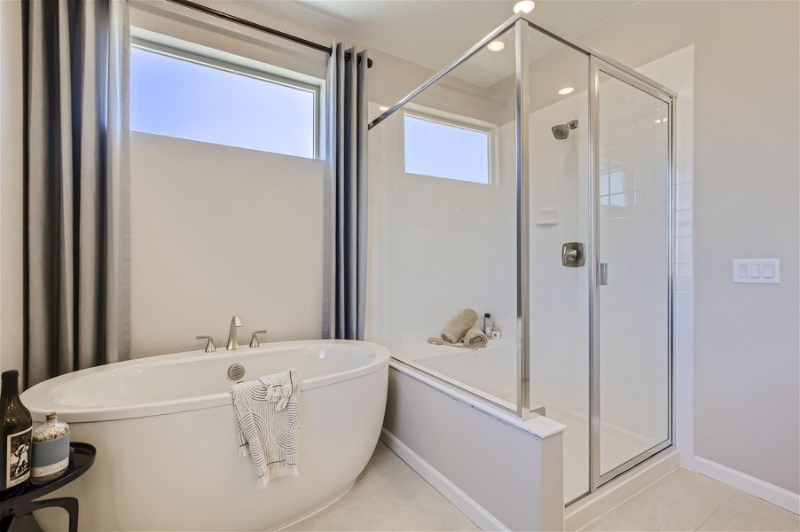 A bathroom with a glass shower. A bathroom with a glass shower.
