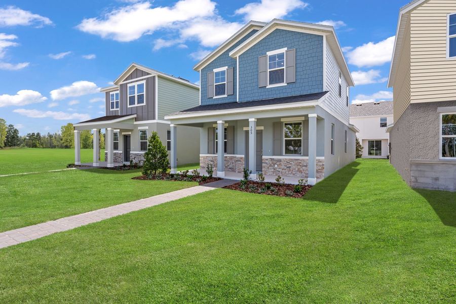 Front exterior of a new home in Brack Ranch, St. Cloud, FL, highlighting curb appeal (Image 24). Front exterior of a new home in Brack Ranch, St. Cloud, FL, highlighting curb appeal (Image 24).