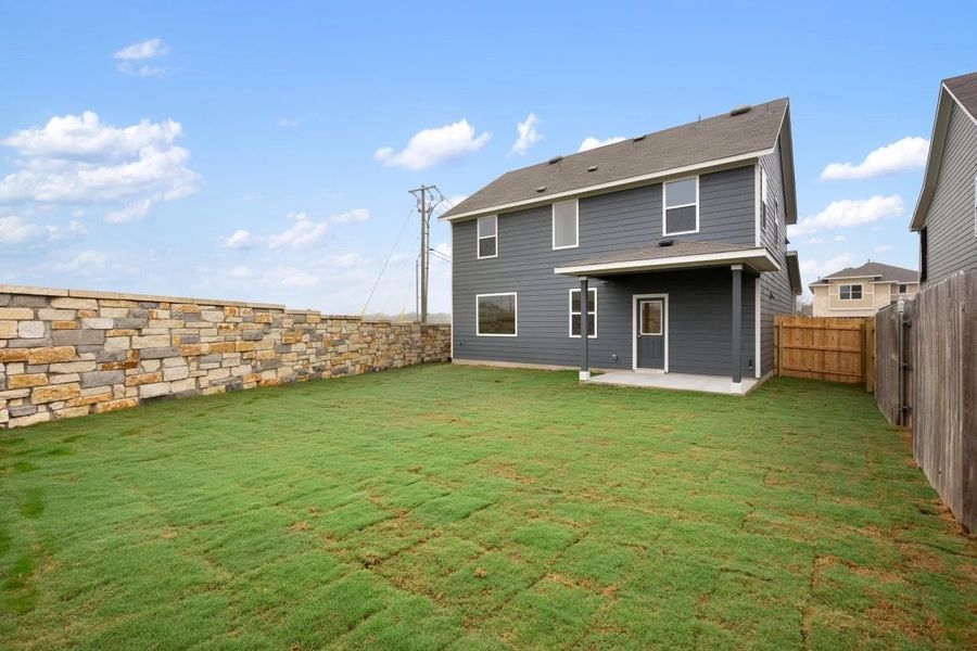 Exterior details and patio area of a home in Covered Bridge, Hutto (Image 21).
