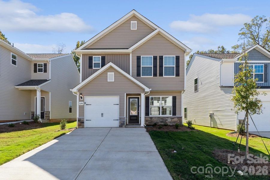 Front exterior of a new home in Creedmore Hills, Charlotte, NC, highlighting curb appeal (Image 2). Front exterior of a new home in Creedmore Hills, Charlotte, NC, highlighting curb appeal (Image 2).