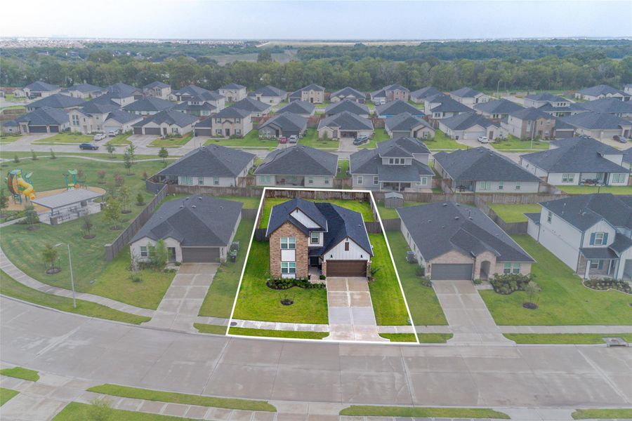 Take in the stunning aerial view of this beautiful home, offering a glimpse of the surrounding neighborhood. Take in the stunning aerial view of this beautiful home, offering a glimpse of the surrounding neighborhood.