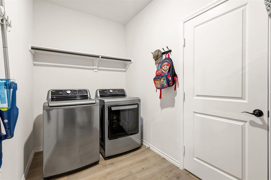 Spacious and functional, this laundry room offers plenty of room for full-size appliances, storage, and everyday organization—making chores feel a whole lot easier Spacious and functional, this laundry room offers plenty of room for full-size appliances, storage, and everyday organization—making chores feel a whole lot easier