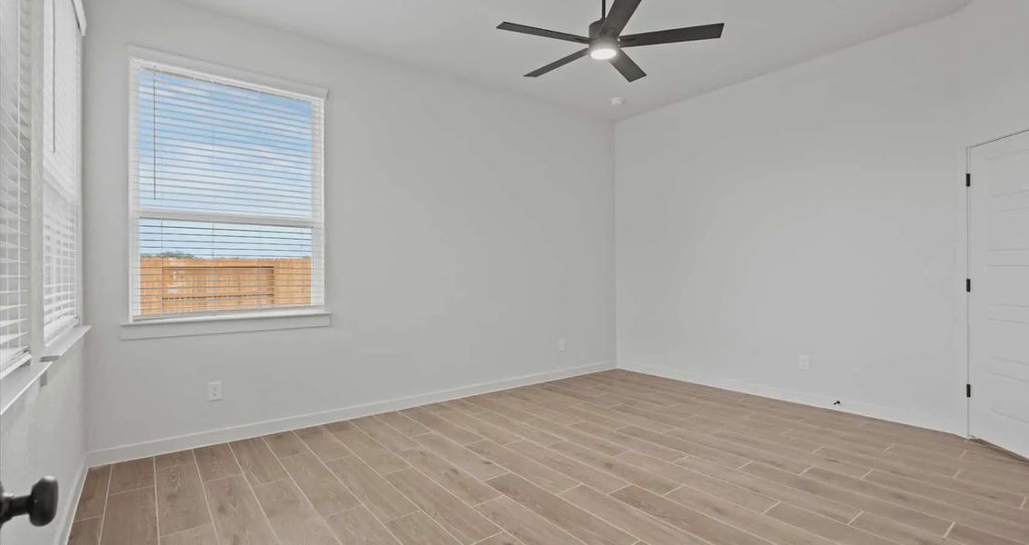 Representative unfurnished interior of a home built from the Rhyan by Chesmar Homes in Stream Waters, Buda (Image 7).