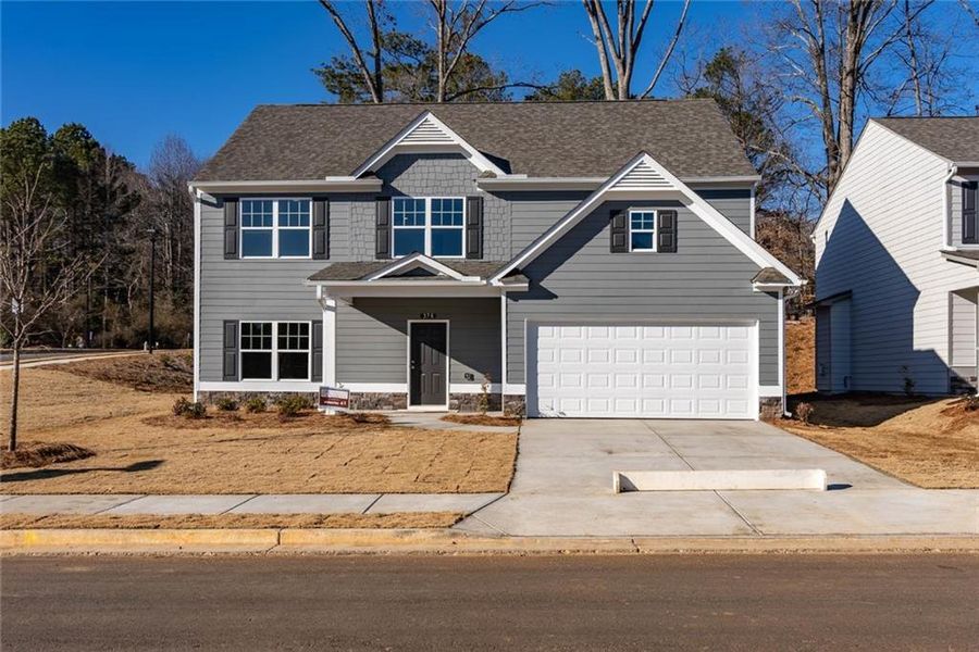 Front exterior of a new home in The Reserve at Willow Oaks, Canton, GA, highlighting curb appeal (Image 1). Front exterior of a new home in The Reserve at Willow Oaks, Canton, GA, highlighting curb appeal (Image 1).
