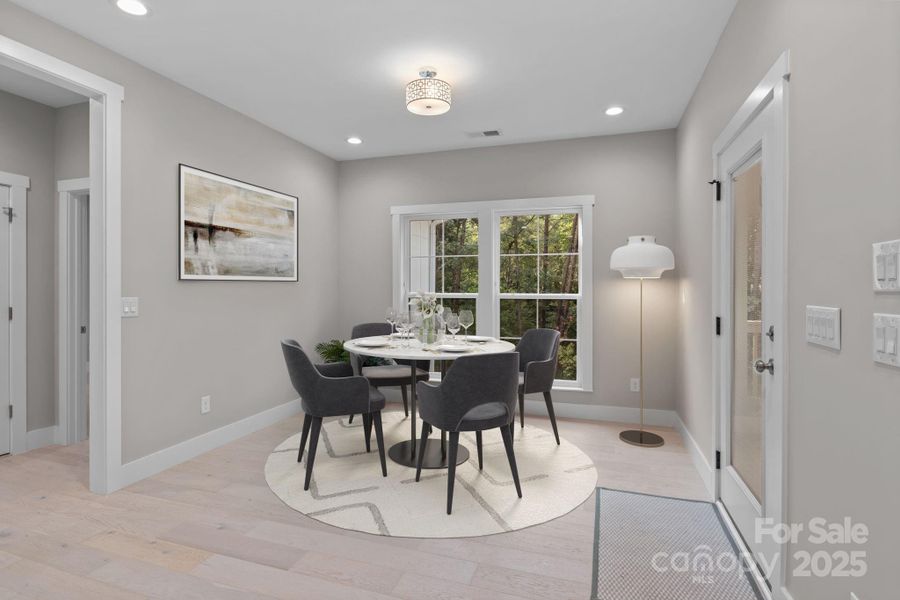 Virtually staged to showcase the breakfast area's natural light and flexible layout for casual dining or morning coffee.