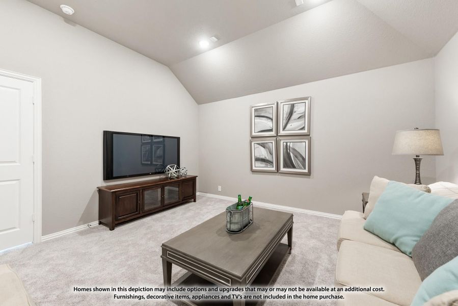 Living room with vaulted ceiling, carpet flooring, TV console, and neutral sofa with coffee table Living room with vaulted ceiling, carpet flooring, TV console, and neutral sofa with coffee table