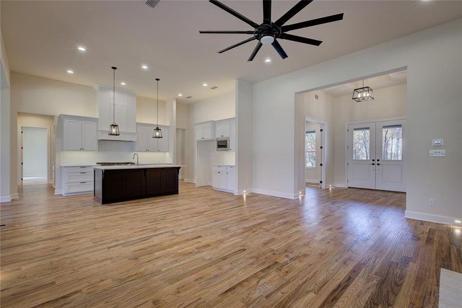 View of entryway and kitchen from fireplace