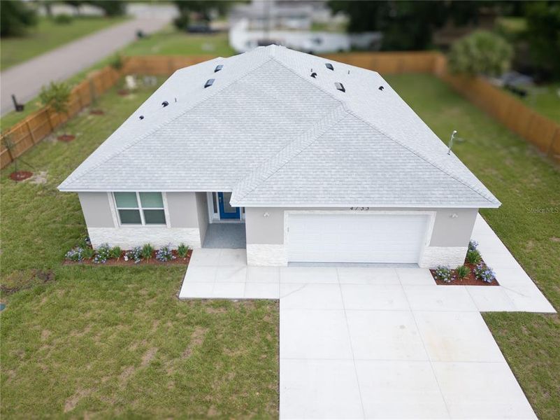 Front exterior of a new home in , Orlando, FL, highlighting curb appeal (Image 19).