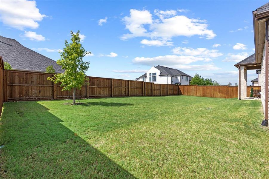 Fenced backyard featuring a patio area