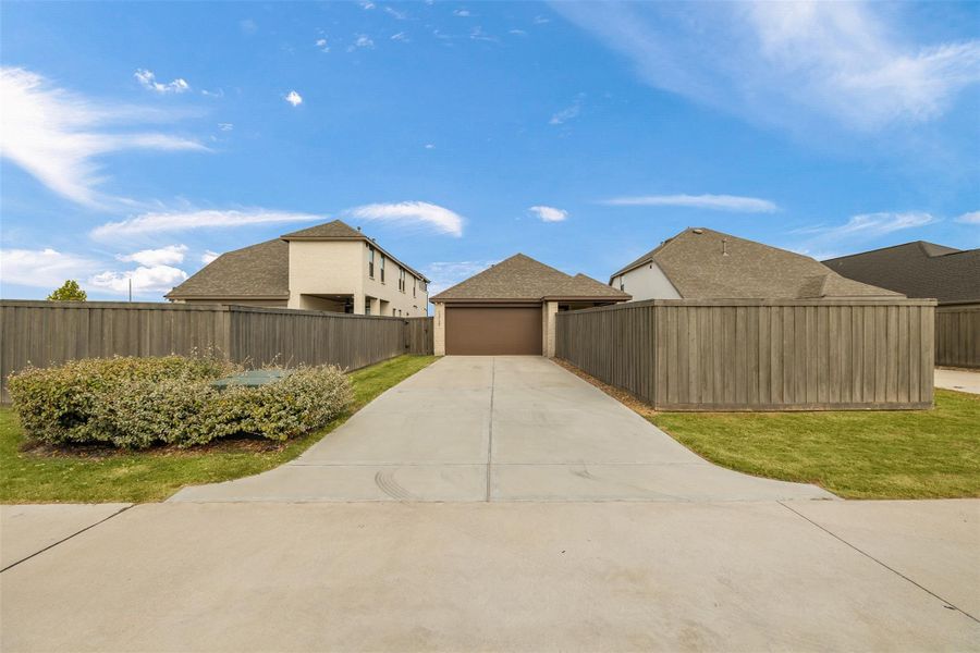 Front exterior of a new home in Riceland, Mont Belvieu, TX, highlighting curb appeal (Image 20).