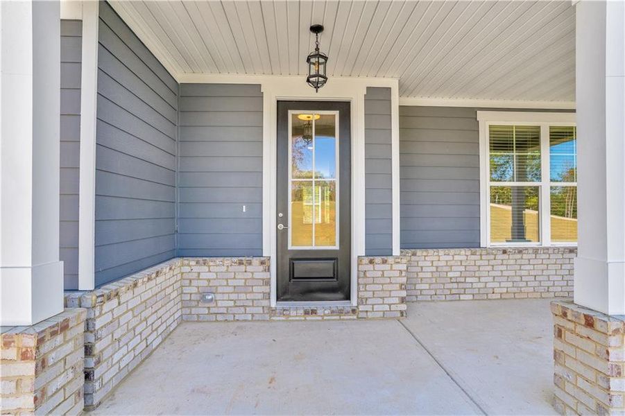 Exterior details and patio area of a home in Waters Edge, Mansfield (Image 15).