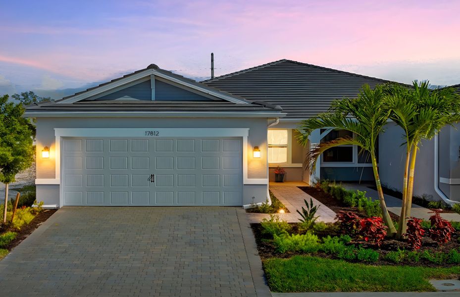 Front exterior of a new home in Legacy Groves, Nokomis, FL, highlighting curb appeal (Image 1).