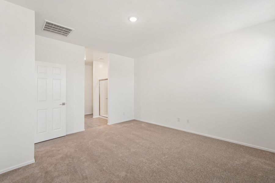 Primary suite. Finishes and options may vary by community