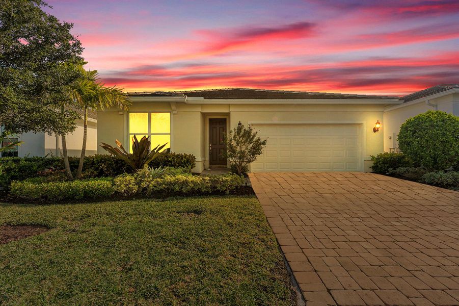 Front exterior of a new home in , Stuart, FL, highlighting curb appeal (Image 1).