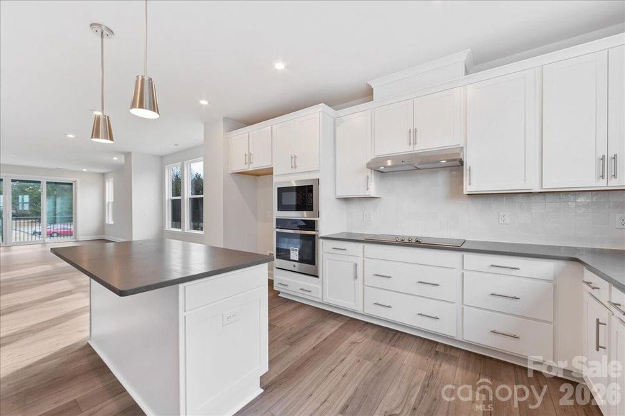 Gourmet Kitchen with White Cabinets and Concrete Grey Quartz Countertops Gourmet Kitchen with White Cabinets and Concrete Grey Quartz Countertops