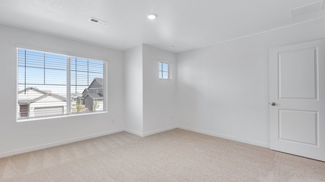 Spacious, unfurnished interior of a new home in Trails at Crowfoot, Parker (Image 18).