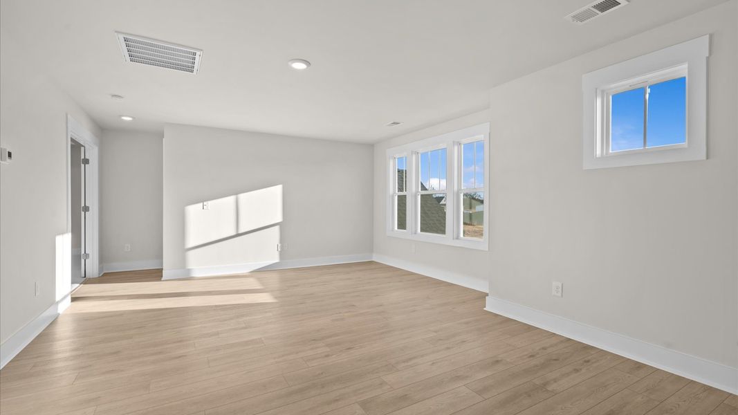 Hardwood flooring enhances the versatility of this elegant upper-level loft space