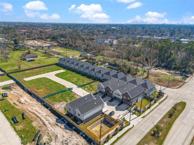Aerial view of this rapidly growing community featuring modern new construction homes with spacious lots and future development opportunities. Conveniently located with easy access to major roads, shopping, and dining.