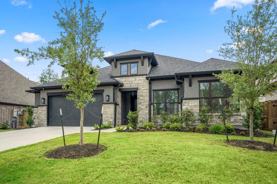 Front exterior of a new home in The Highlands - 65', Porter, TX, highlighting curb appeal (Image 20).