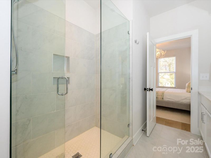 Seamless glass for the shower.  Dual sink vanity.