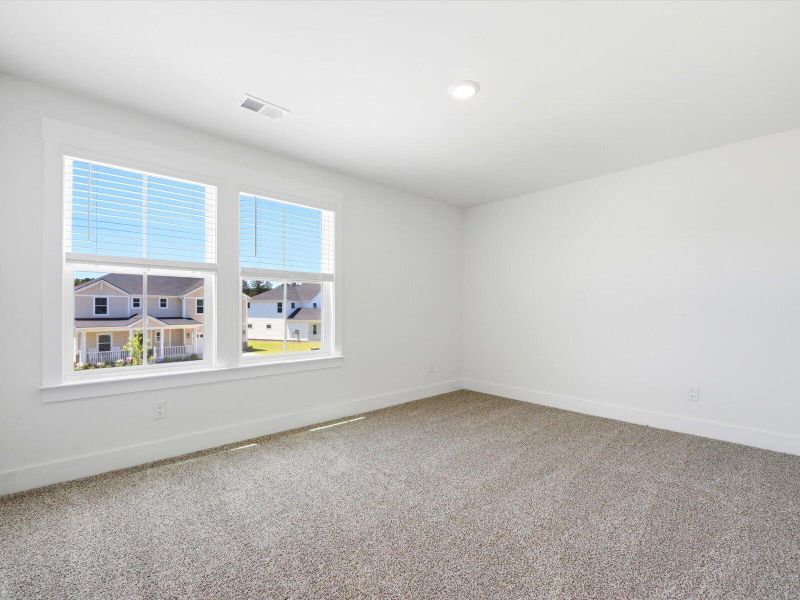 Spacious, unfurnished interior of a new home in The Coves at Lakes of Cane Bay II, Summerville (Image 19). Spacious, unfurnished interior of a new home in The Coves at Lakes of Cane Bay II, Summerville (Image 19).