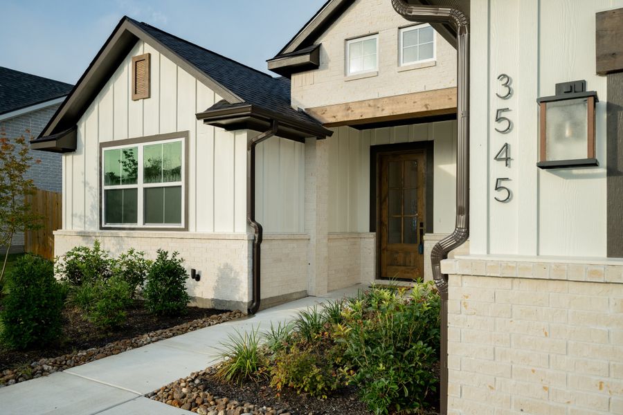 Front exterior of a new home in Greenbrier, Bryan, TX, highlighting curb appeal (Image 22).
