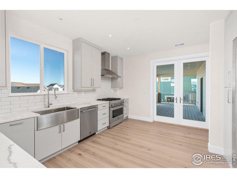 Kitchen with door to covered deck