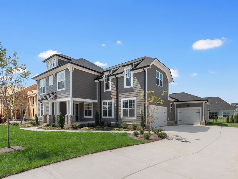 Front exterior of a new home in Shelton Square, Murfreesboro, TN, highlighting curb appeal (Image 2). Front exterior of a new home in Shelton Square, Murfreesboro, TN, highlighting curb appeal (Image 2).