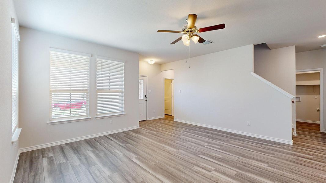 Spare room with ceiling fan, light wood-style flooring, and recessed lighting