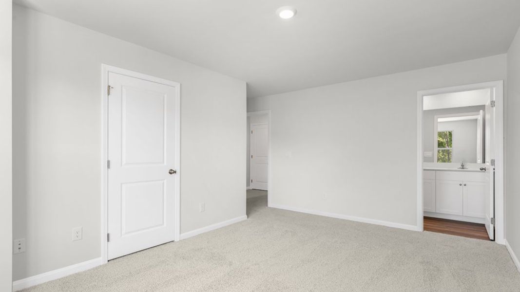 Spacious, unfurnished interior of a new home in The Townes at Belle Grove, Wendell (Image 24).