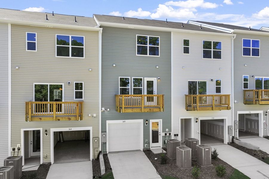 Front exterior of a new home in Renaissance at White Oak, Garner, NC, highlighting curb appeal (Image 22). Front exterior of a new home in Renaissance at White Oak, Garner, NC, highlighting curb appeal (Image 22).