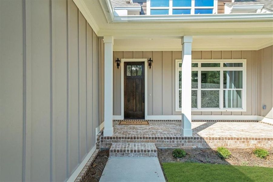Front exterior of a new home in , Gainesville, GA, highlighting curb appeal (Image 1).