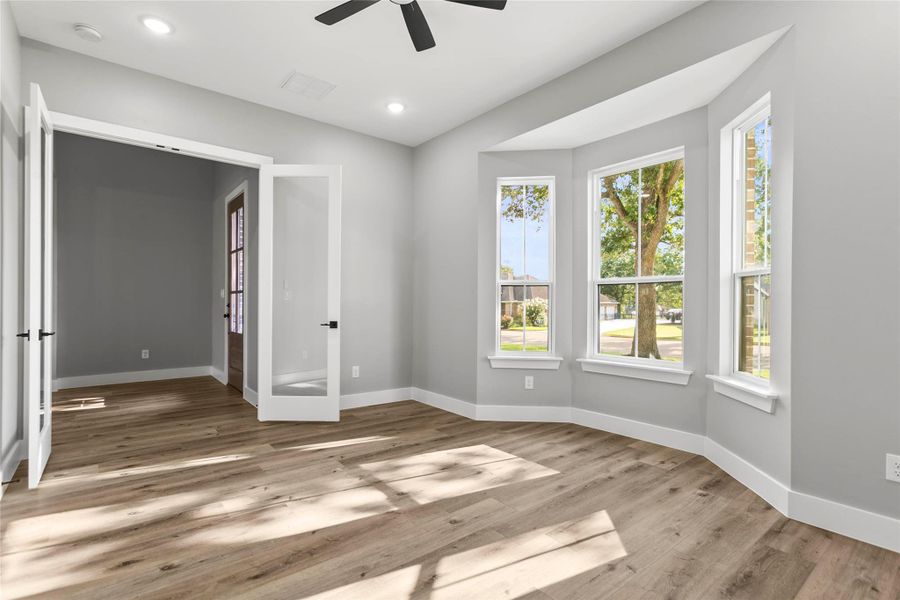 The spacious office/optional 5th bedroom with bay windows and glass French doors makes working from home a breeze! The spacious office/optional 5th bedroom with bay windows and glass French doors makes working from home a breeze!