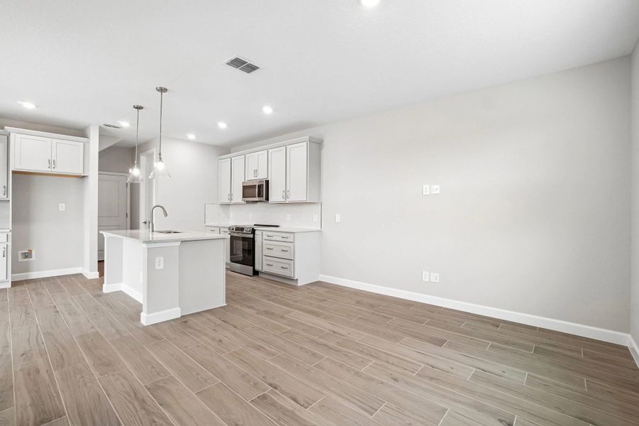 Off the kitchen you will find the family room