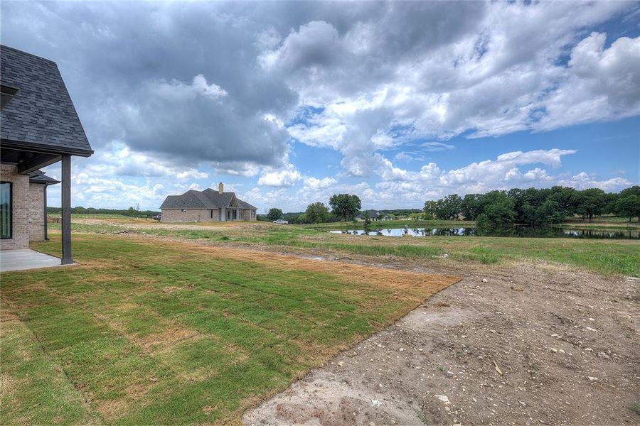 View of yard featuring a water view