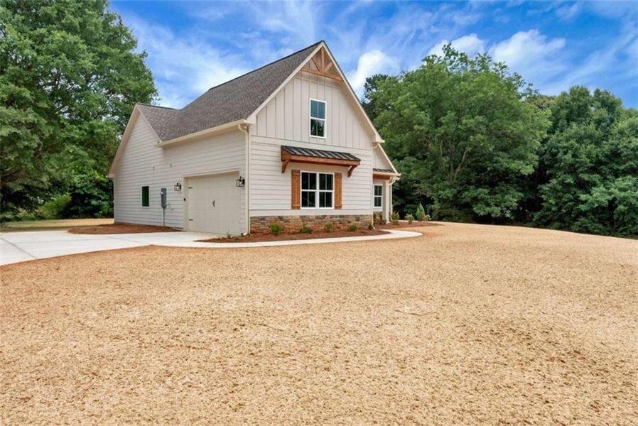 Front exterior of a new home in , Maysville, GA, highlighting curb appeal (Image 25).