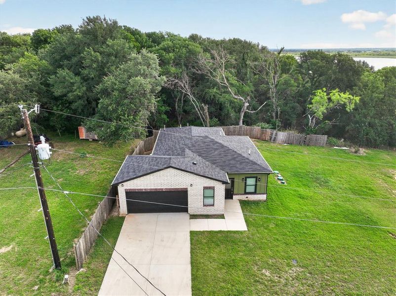 Front exterior of a new home in , Granbury, TX, highlighting curb appeal (Image 25).