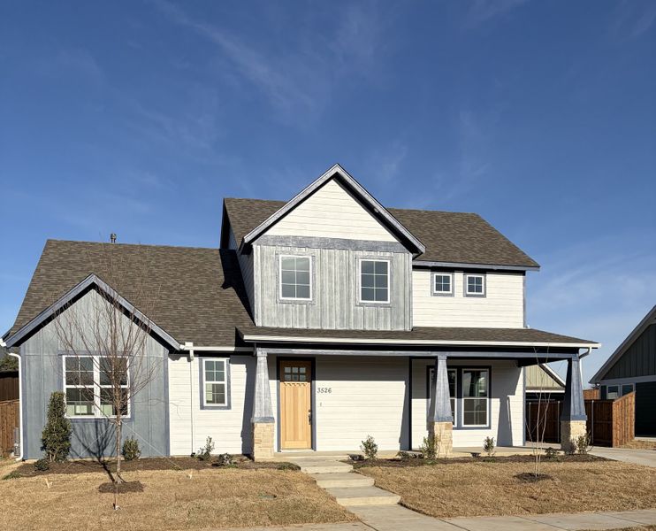 Front exterior of a new home in Heritage Towne, Midlothian, TX, highlighting curb appeal (Image 22). Front exterior of a new home in Heritage Towne, Midlothian, TX, highlighting curb appeal (Image 22).