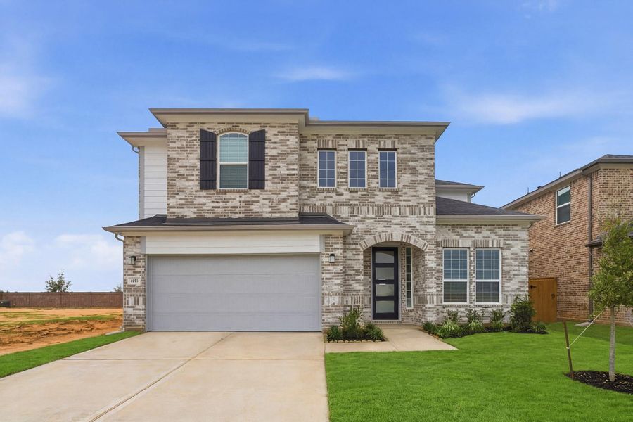 Front exterior of a new home in Sunterra Lakes, Brookshire, TX, highlighting curb appeal (Image 2). Front exterior of a new home in Sunterra Lakes, Brookshire, TX, highlighting curb appeal (Image 2).