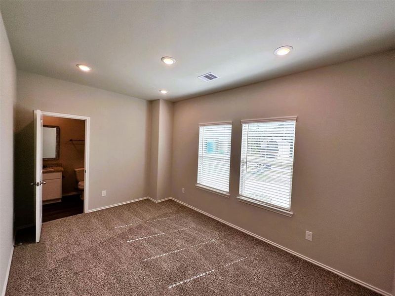 Bedroom 3 is roomy with a walk in closet.