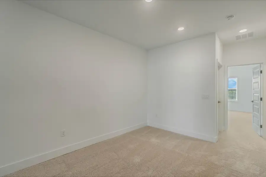 Spacious, unfurnished interior of a new home in Harvest at Ovation - Townhomes, Winter Garden (Image 21).